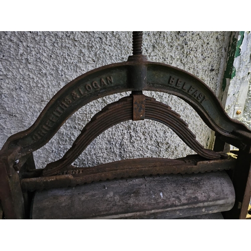 60 - An antique cast iron mangle, produced by Griffiths & Jones - Belfast, with decorative cast panels.