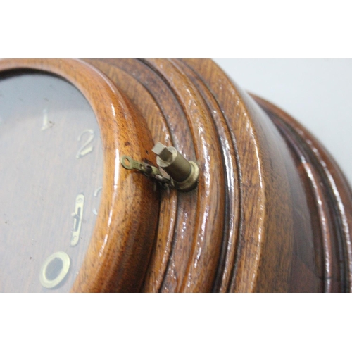 302 - An unusual antique wall clock. 12 x 12 inch