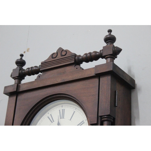 304 - An antique striking wall clock. 36.5 x 14 inch