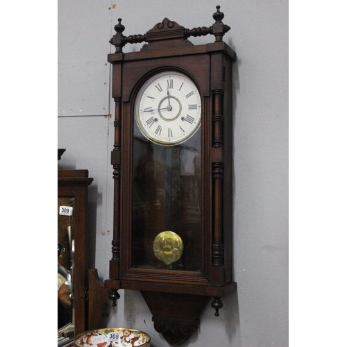 304 - An antique striking wall clock. 36.5 x 14 inch