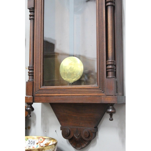 304 - An antique striking wall clock. 36.5 x 14 inch