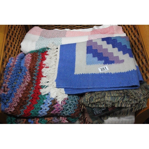351 - A collection of vintage rugs and blankets.