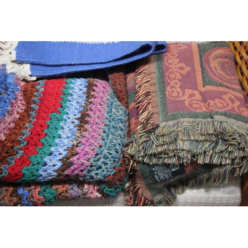 351 - A collection of vintage rugs and blankets.
