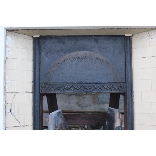 508 - An antique/ Victorian cast iron fireplace with tiled insert.