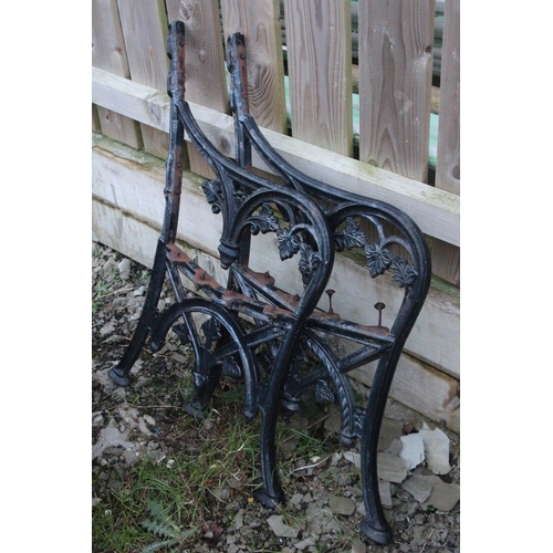 509 - A set of decorative cast iron bench ends.