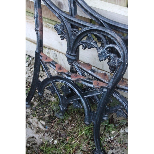 509 - A set of decorative cast iron bench ends.