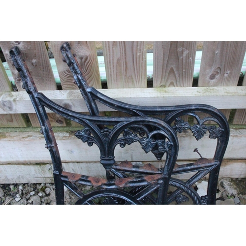 509 - A set of decorative cast iron bench ends.