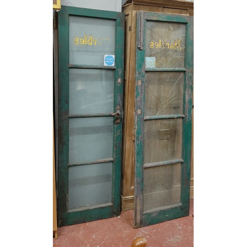 494 - A set of vintage shop doors, 'Marbles', in need of some restoration.