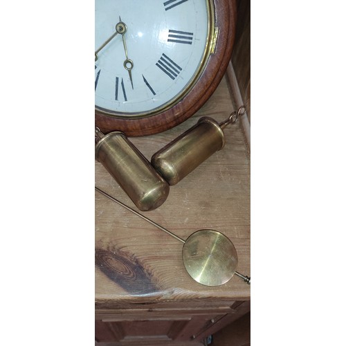 490 - An antique wood cased wall clock with two weights.