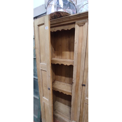 496 - A stunning Irish pine cabinet with folding doors, in need of light restoration. 49.5 x 80 inch