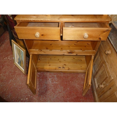 467 - A pine kitchen cabinet with built in bottle rack. 40 x 40.5 inch