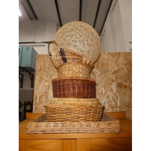 469 - A large assortment of wicker baskets and more.