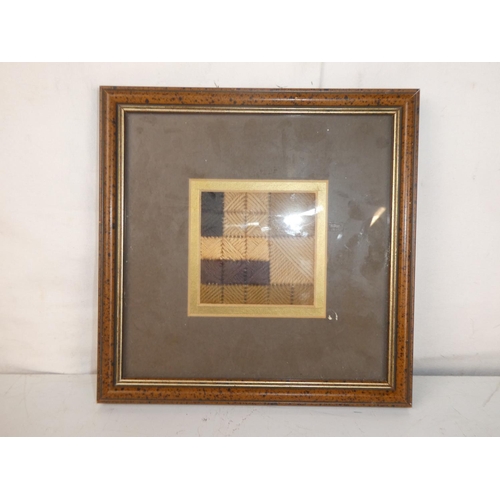 472 - A framed woven art piece.