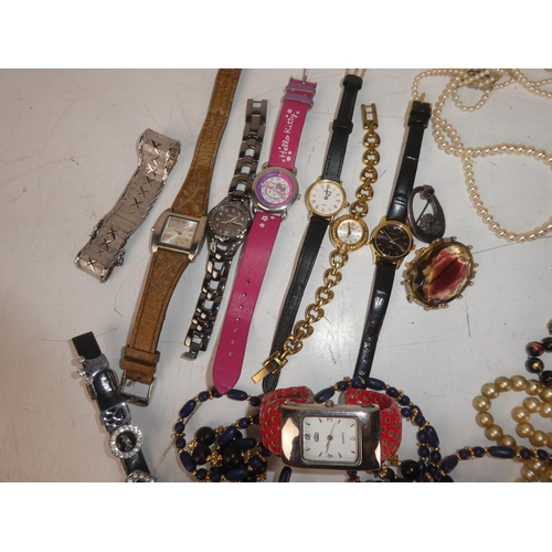 475 - An assortment of costume jewellery and watches, housed inside a jewellery box.