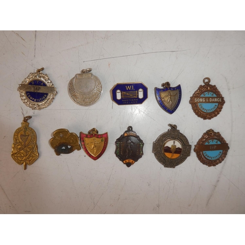 476 - A collection of vintage medals of Irish dancing and Girls Guide interest.