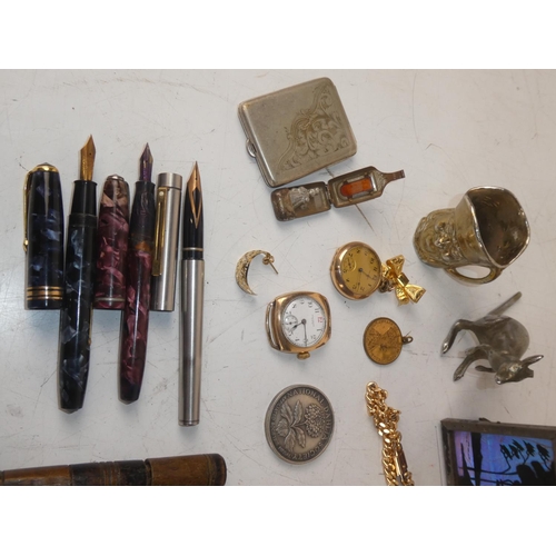 478 - An assortment of items to include pocket knives, pens, watches, silver plated items and more.