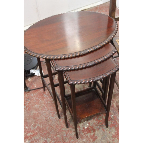 271B - A mahogany nest of three tables and an oak framed occasional chair.