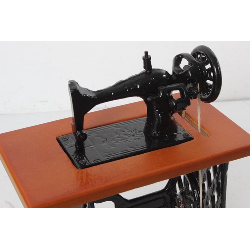 375 - A miniature Singer Sewing machine.