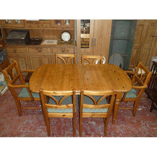 446 - A pine extendable dining table and 6 chairs. 62 x 35.5x 30 inch