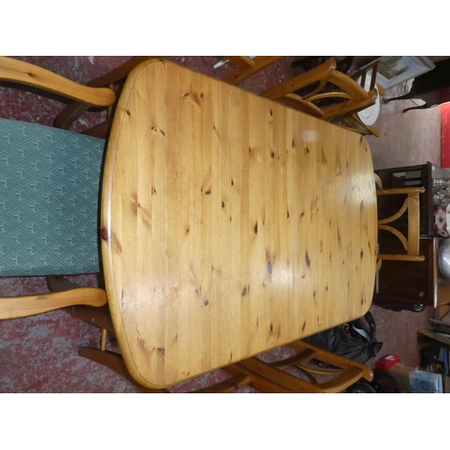 446 - A pine extendable dining table and 6 chairs. 62 x 35.5x 30 inch