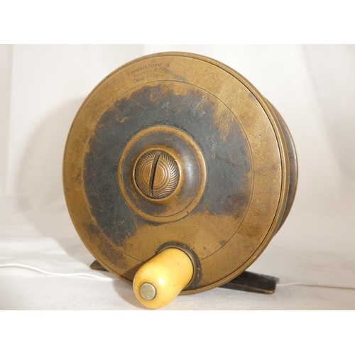 An antique brass fly fishing reel, 'Forrest's Patent Adjustable Drag Reel'.