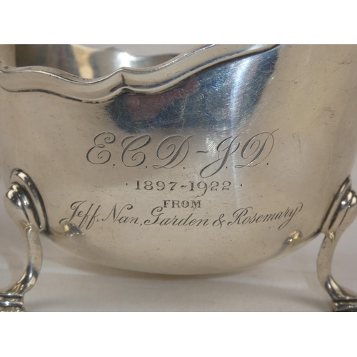 94 - A Sterling Silver sauceboat, engraved and dated 1897 - 1922, weight 207g.