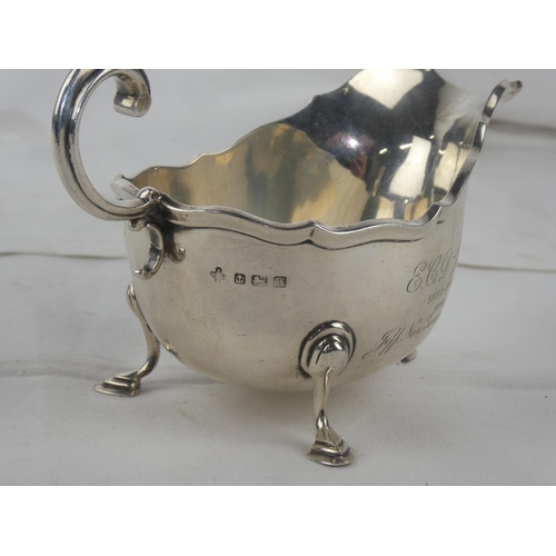 94 - A Sterling Silver sauceboat, engraved and dated 1897 - 1922, weight 207g.