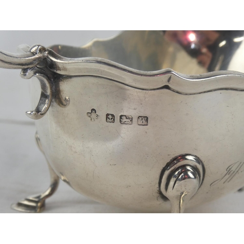 94 - A Sterling Silver sauceboat, engraved and dated 1897 - 1922, weight 207g.