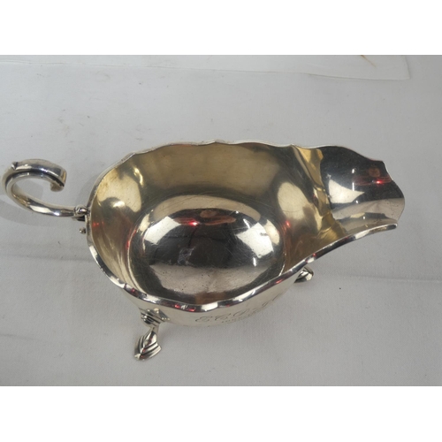 94 - A Sterling Silver sauceboat, engraved and dated 1897 - 1922, weight 207g.