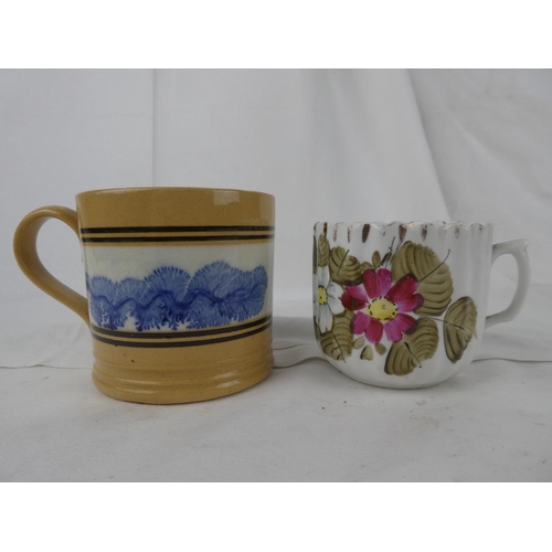 99 - An antique mug and an antique floral patterned moustache cup.