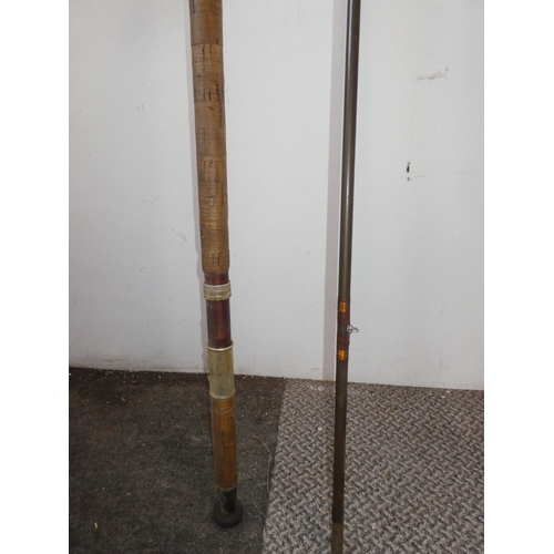 118 - A vintage two piece fishing rod.