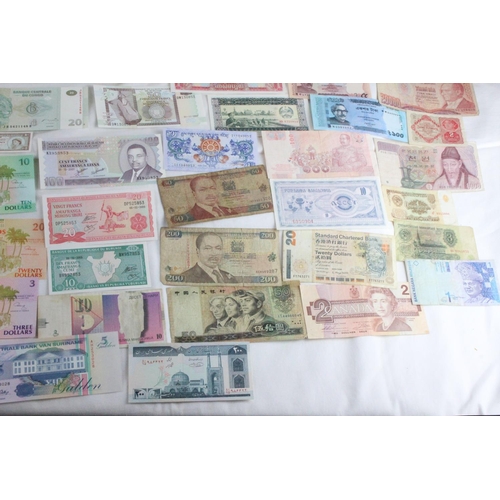 370 - A lot of assorted foreign bank notes to include Kenya, France, Belgium, Hong Kong, China, and lots m... 