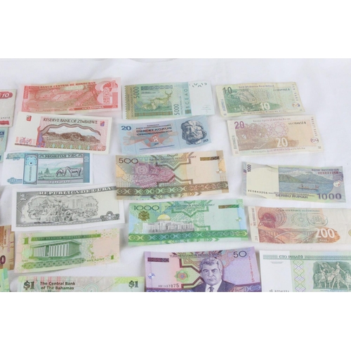 373 - A lot of assorted foreign bank notes from, Japan, South Africa, Germany, Bahamas, Cuba, Zimbabwe, Ho... 