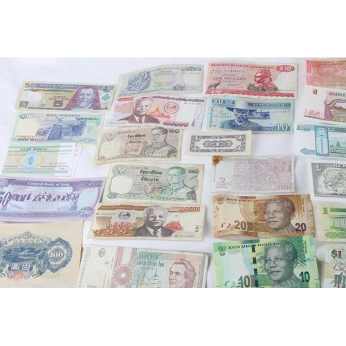 373 - A lot of assorted foreign bank notes from, Japan, South Africa, Germany, Bahamas, Cuba, Zimbabwe, Ho... 