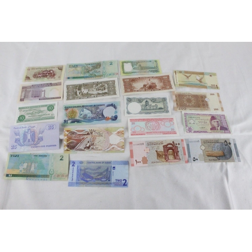 382 - A lot of assorted foreign bank notes from Bhutan, Pakistan, Syria, Sudan, Cayman Islands, Brazil, Th... 