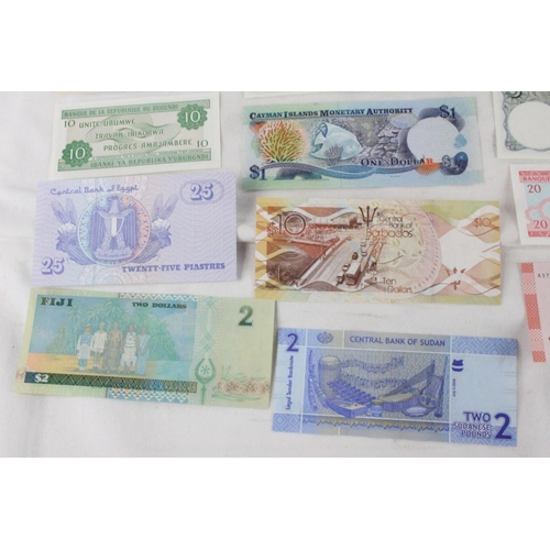 382 - A lot of assorted foreign bank notes from Bhutan, Pakistan, Syria, Sudan, Cayman Islands, Brazil, Th... 