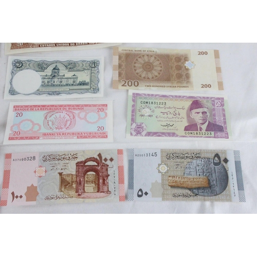 382 - A lot of assorted foreign bank notes from Bhutan, Pakistan, Syria, Sudan, Cayman Islands, Brazil, Th... 