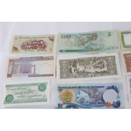 382 - A lot of assorted foreign bank notes from Bhutan, Pakistan, Syria, Sudan, Cayman Islands, Brazil, Th... 