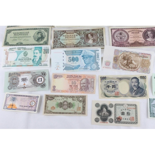 386 - A lot of assorted foreign bank notes from Biafra, Bulgaria, Uruguay, India, Zaire, Samoa, Japan, Sco... 