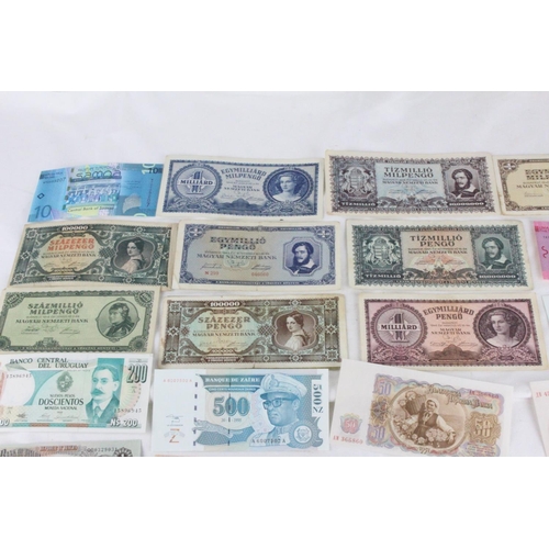 386 - A lot of assorted foreign bank notes from Biafra, Bulgaria, Uruguay, India, Zaire, Samoa, Japan, Sco... 