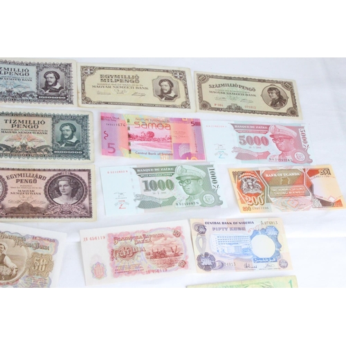 386 - A lot of assorted foreign bank notes from Biafra, Bulgaria, Uruguay, India, Zaire, Samoa, Japan, Sco... 