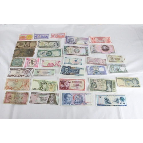 390 - A lot of assorted foreign bank notes from Sri Lanka, Cyprus, Germany, Canada, Vietnam, Trinidad, Nep... 