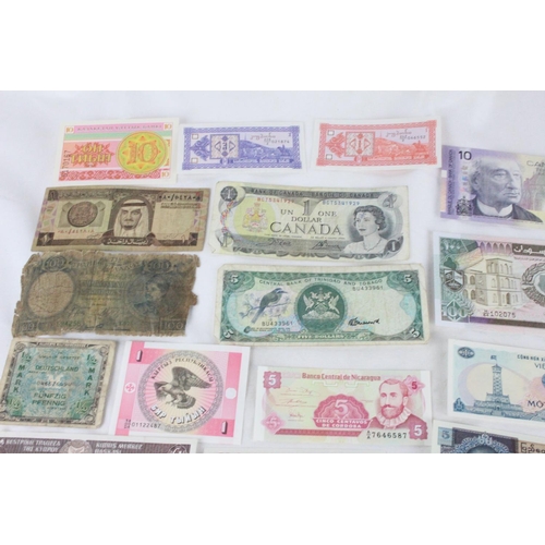 390 - A lot of assorted foreign bank notes from Sri Lanka, Cyprus, Germany, Canada, Vietnam, Trinidad, Nep... 