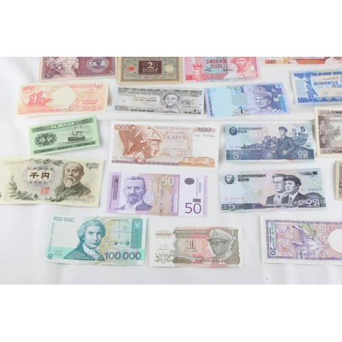 391 - A lot of assorted foreign bank notes from Japan, Zambia, Serbia, Greece, Brazil, Hong-Kong, North Ko... 