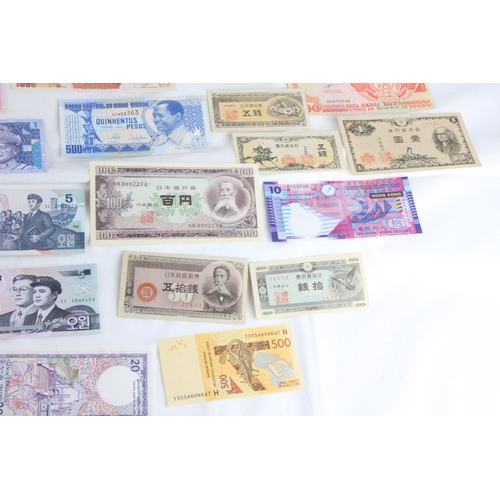 391 - A lot of assorted foreign bank notes from Japan, Zambia, Serbia, Greece, Brazil, Hong-Kong, North Ko... 