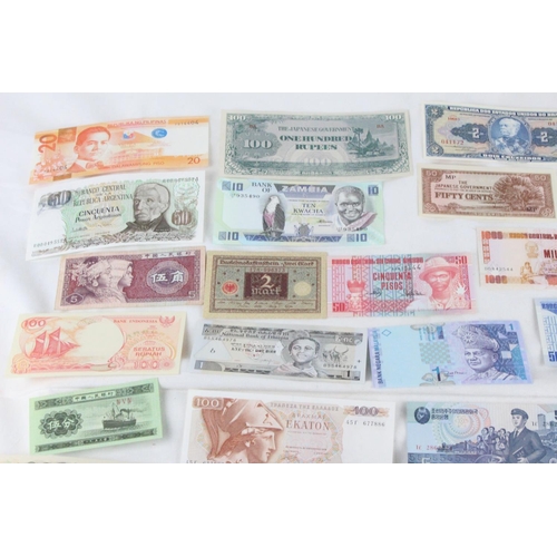 391 - A lot of assorted foreign bank notes from Japan, Zambia, Serbia, Greece, Brazil, Hong-Kong, North Ko... 