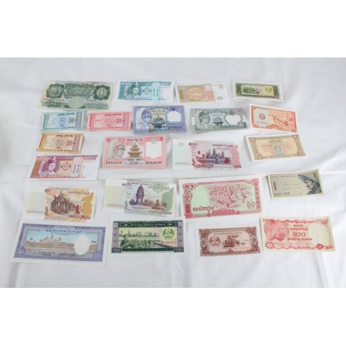 399 - A lot of assorted foreign bank notes from Cambodia, U.K, Loas, Nepal , Mongolia and more.