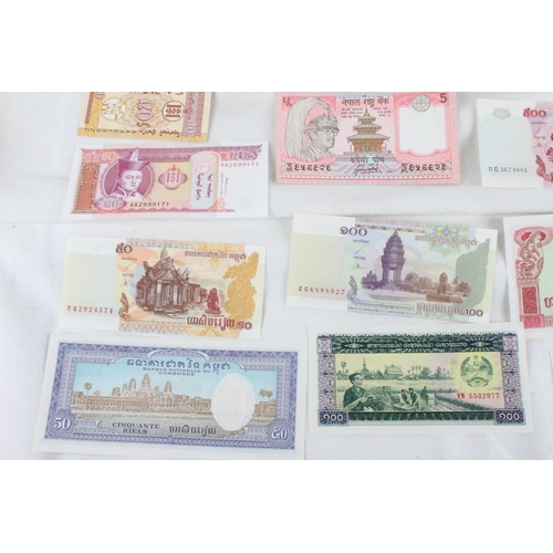 399 - A lot of assorted foreign bank notes from Cambodia, U.K, Loas, Nepal , Mongolia and more.