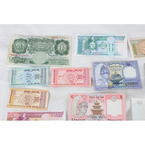 399 - A lot of assorted foreign bank notes from Cambodia, U.K, Loas, Nepal , Mongolia and more.