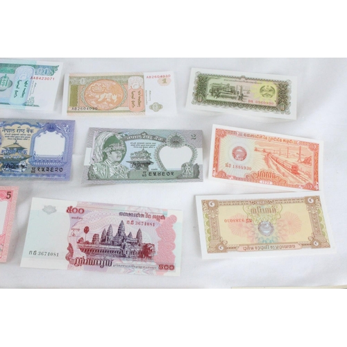 399 - A lot of assorted foreign bank notes from Cambodia, U.K, Loas, Nepal , Mongolia and more.